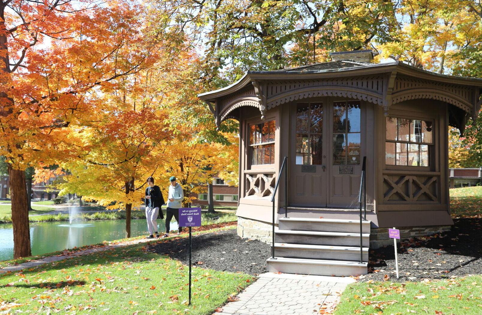 Two male students walk by the Mark Twain study 