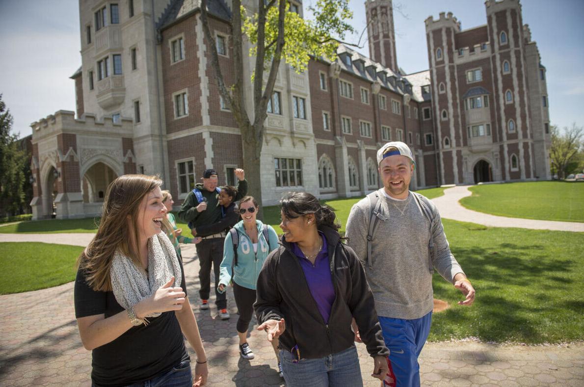 A group of students walk by Meier Hall